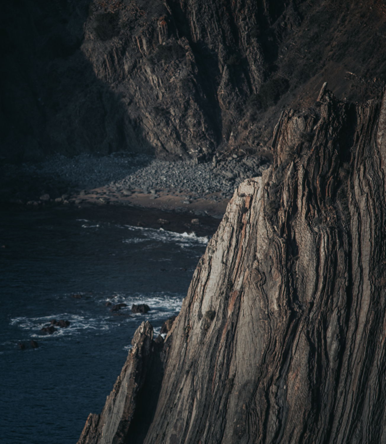 Sea cliff, cropped vertical, after