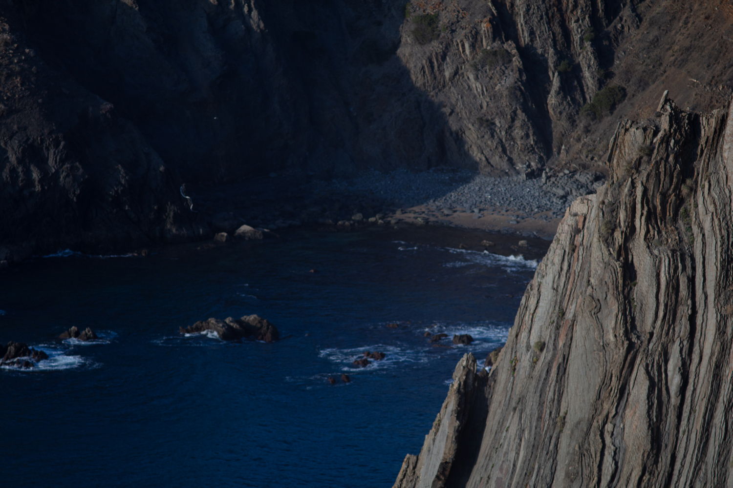 Sea cliff, cropped vertical, before