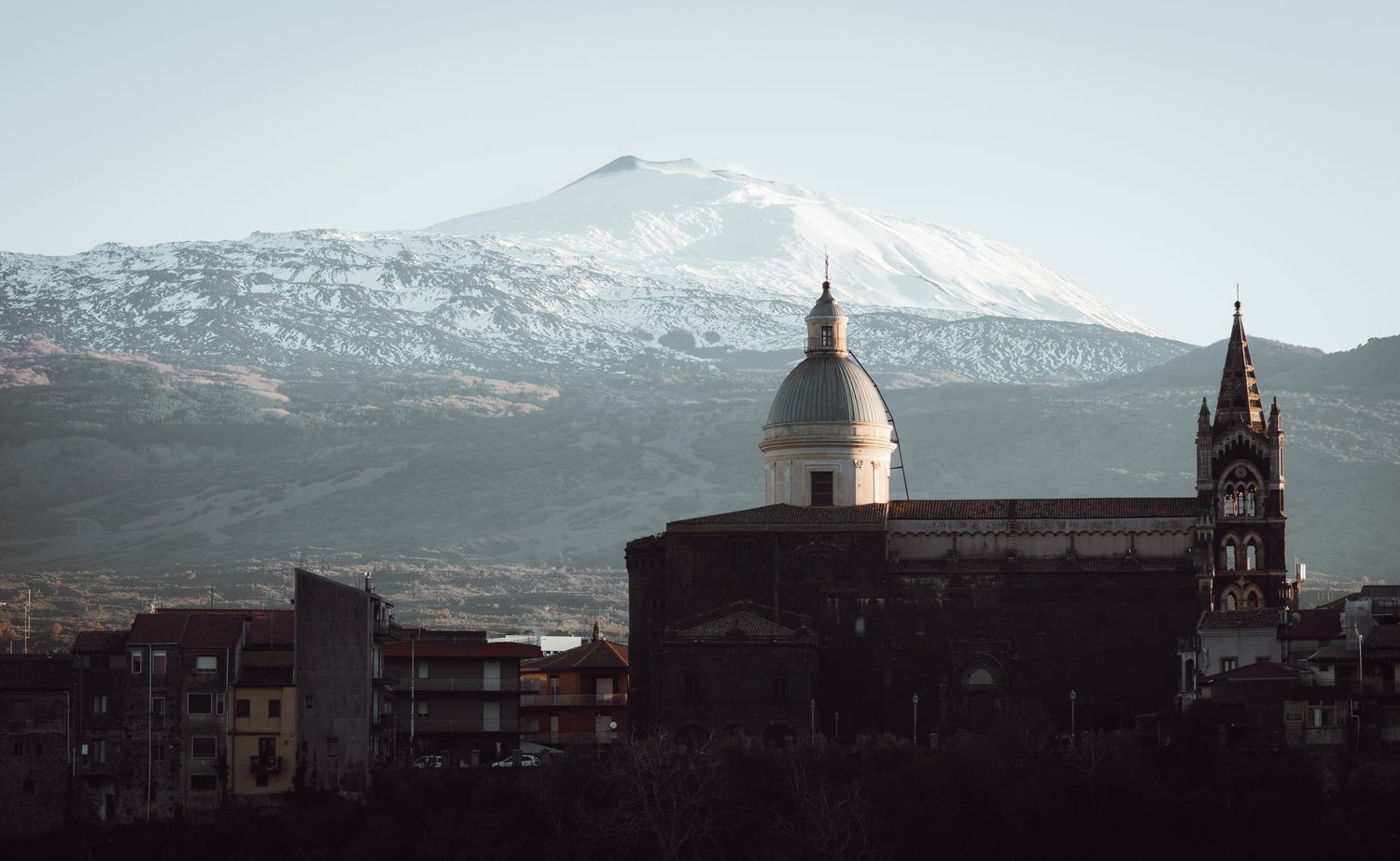 Volcano above a hill town, after