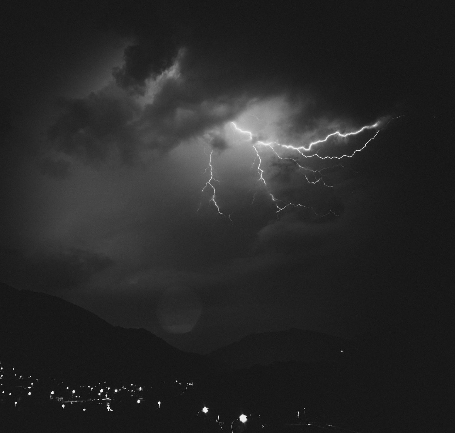Storm over a valley town, after